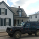Project Swiss Cheese stands in front of Walter P. Chrysler’s childhood home in Ellis, Kansas.